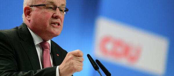 Volker Kauder, chairman of the CDU/CSU faction in parliament, addresses delegates at the Christian Democratic Union (CDU) congress in Cologne, western Germany, on December 10, 2014 - Sputnik International