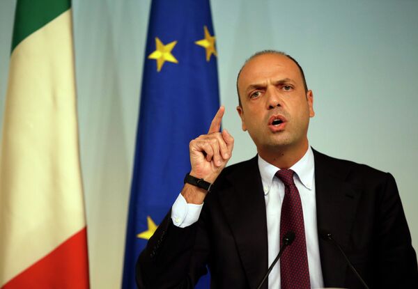 In this Friday, Oct. 31, 2014 file photo, Italian Interior Minister Angelino Alfano meets journalists during a press conference to present the EU 'Tritone' migrants rescue mission, in Rome's Palazzo Chigi government office In this Friday, Oct. 31, 2014 file photo, Italian Interior Minister Angelino Alfano meets journalists during a press conference to present the EU 'Tritone' migrants rescue mission, in Rome's Palazzo Chigi government office - Sputnik International