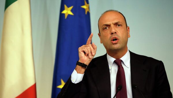 In this Friday, Oct. 31, 2014 file photo, Italian Interior Minister Angelino Alfano meets journalists during a press conference to present the EU 'Tritone' migrants rescue mission, in Rome's Palazzo Chigi government office - Sputnik International