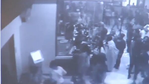 Screenshot of security camera footage from a Florida theater in which 900 teens rampaged through for free movies - Sputnik International