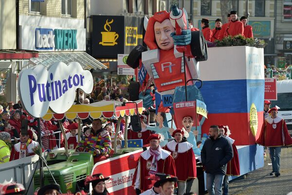 A carnival float depicts Russia's president Putin as a robot out of control named Putinator, , during the traditional carnival parade in Cologne, western Germany, Monday, Feb. 16, 2015 A carnival float depicts Russia's president Putin as a robot out of control named Putinator, , during the traditional carnival parade in Cologne, western Germany, Monday, Feb. 16, 2015 - Sputnik International