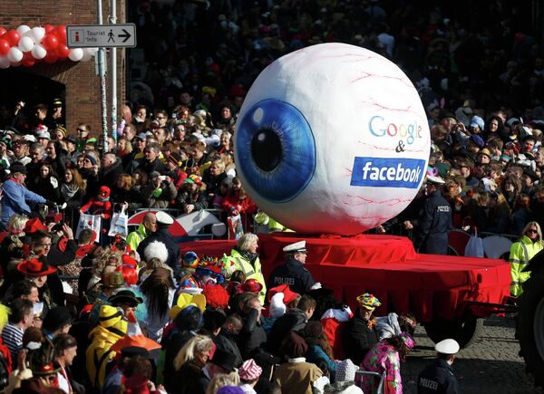 A carnival float with a papier-mache caricature representing Google and Facebook takes part in the traditional Rose Monday carnival parade in the western German city of Duesseldorf February 16, 2015 A carnival float with a papier-mache caricature representing Google and Facebook takes part in the traditional Rose Monday carnival parade in the western German city of Duesseldorf February 16, 2015 - Sputnik International
