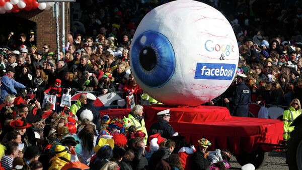 A carnival float with a papier-mache caricature representing Google and Facebook takes part in the traditional Rose Monday carnival parade in the western German city of Duesseldorf February 16, 2015 - Sputnik International