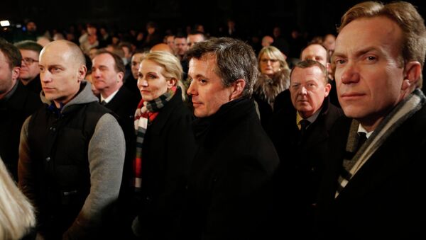 Danish Prime Minister Helle Thorning-Schmidt (3rd L), her husband Stephen Kinnock (L), Crown Prince Frederik (C), Liberal leader Lars Lokke Rasmussen (2nd R) and Norwegian Foreign Minister Borge Brende (R) stand together during a memorial service for victims of deadly attacks on a synagogue and an event promoting free speech, in Copenhagen February 16, 2015 - Sputnik International