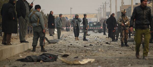 Afghan security personnel inspect the scene of a suicide attack on a European Union police vehicle along the Kabul-Jalalabad road in Kabul on January 5, 2015 Afghan security personnel inspect the scene of a suicide attack on a European Union police vehicle along the Kabul-Jalalabad road in Kabul on January 5, 2015 - Sputnik International