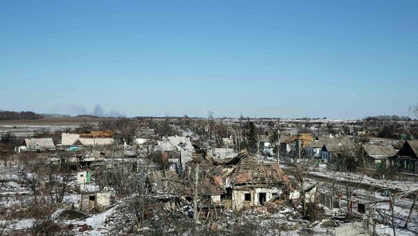 Buildings damaged by fighting are pictured in the village of Nikishine, south east of Debaltseve February 17, 2015 - Sputnik International