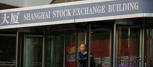 A man walks out of the Shanghai Stock Exchange building at the Pudong financial district in Shanghai A man walks out of the Shanghai Stock Exchange building at the Pudong financial district in Shanghai - Sputnik International