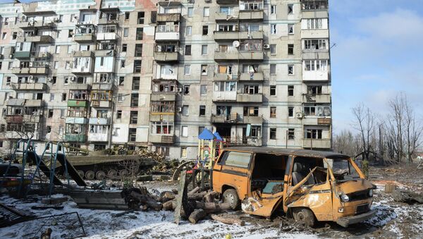 A house damaged by an artillery shelling in the settlement of Oktyabrsky in Donetsk. - Sputnik International