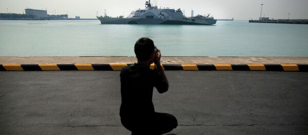 A man photographs US Navy ship USS Freedom (LCS 1) as it berths at the Changi Naval Base on Thursday April 18, 2013 in Singapore A man photographs US Navy ship USS Freedom (LCS 1) as it berths at the Changi Naval Base on Thursday April 18, 2013 in Singapore - Sputnik International