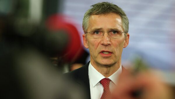 NATO Secretary General Jens Stoltenberg speaks with journalists prior to an Informal Meeting of EU Defence Ministers in Riga, Latvia on January 18, 2015 - Sputnik International