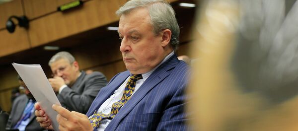 Russia's ambassador to the International Atomic Energy Agency (IAEA) Grigory Berdennikov reads documents - Sputnik International