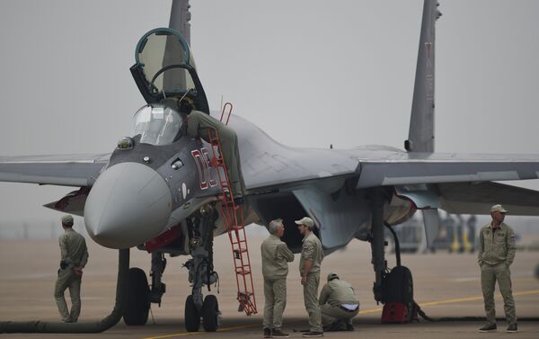 A Sukhoi SU-35 fighter jet is displayed before a test flight ahead of the Airshow China 2014 in Zhuhai, South China's Guangdong province - Sputnik International