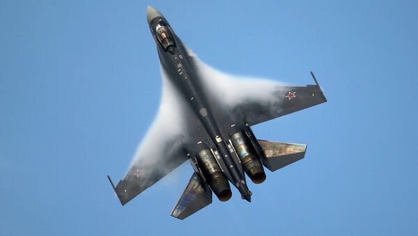A Sukhoi SU-35 jetfigther performs its demonstration flight during the 50th Paris Air Show at Le Bourget airport, north of Paris - Sputnik International