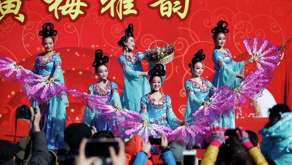 Traditional dancers perform at the Temple Fair, part of Chinese New Year celebrations at Ditan Park, also known as the Temple of Earth, in Beijing - Sputnik International