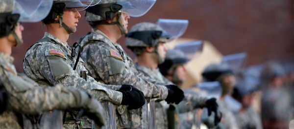 National Guard troops stand in front of the Ferguson, Mo., Police Department a day after a grand jury's decision in the fatal shooting of Michael Brown. Newly released documents reveal that police planning for a grand jury announcement wanted Guard troops and armored Humvees stationed in the Ferguson neighborhood where Brown had been shot. National Guard troops stand in front of the Ferguson, Mo., Police Department a day after a grand jury's decision in the fatal shooting of Michael Brown. Newly released documents reveal that police planning for a grand jury announcement wanted Guard troops and armored Humvees stationed in the Ferguson neighborhood where Brown had been shot. - Sputnik International