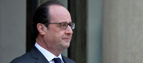 French President François Hollande is pictured after escorting German chancellor Angela Merkel out of the Elysee palace following their meeting French President François Hollande is pictured after escorting German chancellor Angela Merkel out of the Elysee palace following their meeting - Sputnik International