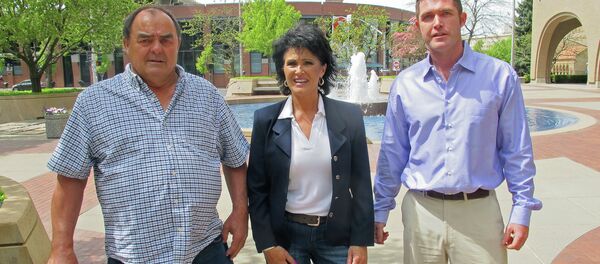 Larry Harvey, Rhonda Firestack-Harvey, and Rolland Gregg stand in the plaza in front of the federal courthouse in Spokane, Wash. The three are charged with growing marijuana at a remote farm near Kettle Falls, Wash. - Sputnik International