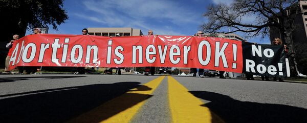 Anti-abortion advocates march to the Texas Capitol during a Texas Rally for Life in Austin. Anti-abortion advocates march to the Texas Capitol during a Texas Rally for Life in Austin. - Sputnik International