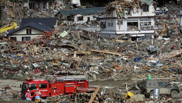 Fire fighters search for survivors following the March 11 earthquake and tsunami in Rikuzentakata, Iwate prefecture, northeastern Japan, Friday, March 18, 2011. (File) - Sputnik International
