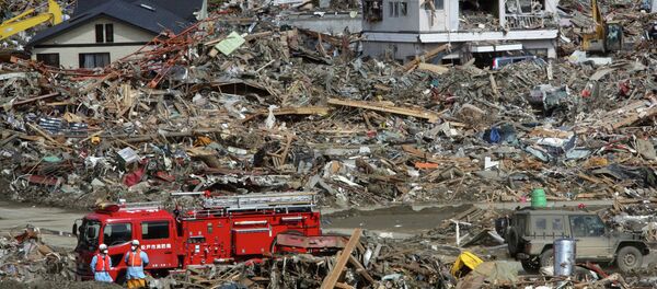 Fire fighters search for survivors following the March 11 earthquake and tsunami in Rikuzentakata, Iwate prefecture, northeastern Japan, Friday, March 18, 2011. (File) Fire fighters search for survivors following the March 11 earthquake and tsunami in Rikuzentakata, Iwate prefecture, northeastern Japan, Friday, March 18, 2011. (File) - Sputnik International