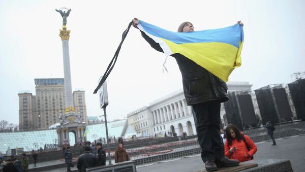 A participant marking the anniversary of the events on Kiev's Independence Square - Sputnik International