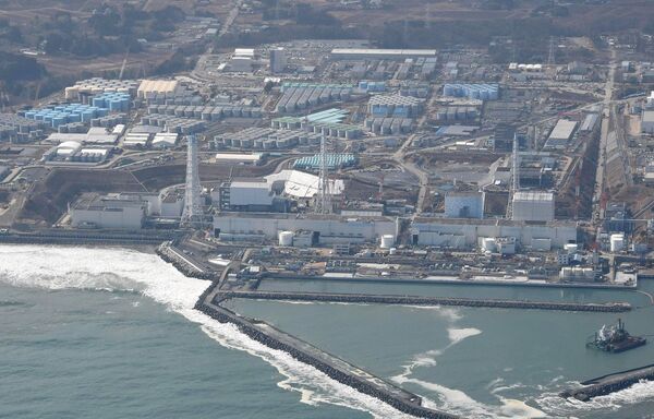 An aerial photo shows the Fukushima No. 1 nuclear power plant being decomissioned in Okuma, Fukushima Prefecture on Feb. 21, 2015, nearly 4 years after the plant diaster. The Fukushima No. 1 nuclear power plant, operated Tokyo Electric Power Co. (TEPCO) , was heavily damaged by a hydrogen explosion following the March 2011 Great East Japan Earthquake and the ensuing tsunami. TEPCO has worked to remove the e radioactive spent fuel from the crippled plant.  - Sputnik International