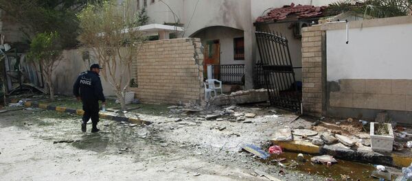 A security personnel stands near the site of a bomb blast at the gate of the Iranian ambassador's residence in Tripoli, February 22, 2015 A security personnel stands near the site of a bomb blast at the gate of the Iranian ambassador's residence in Tripoli, February 22, 2015 - Sputnik International