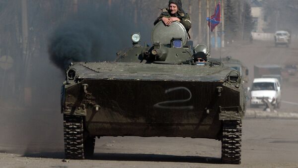 Independence supporters drive armoured personnel carrier (APC) in the eastern Ukrainian city of Debaltseve in the Donetsk region, on February 22, 2015 - Sputnik International