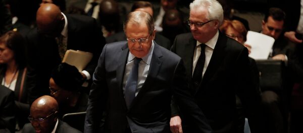 Russian Foreign Minister Sergey Lavrov takes his seat for a meeting of the United Nations Security Council at the U.N. headquarters in New York, February 23, 2015. At right is Russian Ambassador to the United Nations Vitaly Churkin - Sputnik International