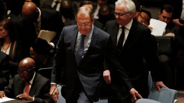 Russian Foreign Minister Sergey Lavrov takes his seat for a meeting of the United Nations Security Council at the U.N. headquarters in New York, February 23, 2015. At right is Russian Ambassador to the United Nations Vitaly Churkin - Sputnik International
