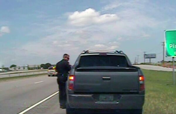 A police officer speaks with George Zimmerman after he was pulled over for speeding along U.S. 80, about 20 miles east of Dallas on Sunday, July 28, 2013. Zimmerman was released with a warning. A police officer speaks with George Zimmerman after he was pulled over for speeding along U.S. 80, about 20 miles east of Dallas on Sunday, July 28, 2013. Zimmerman was released with a warning. - Sputnik International
