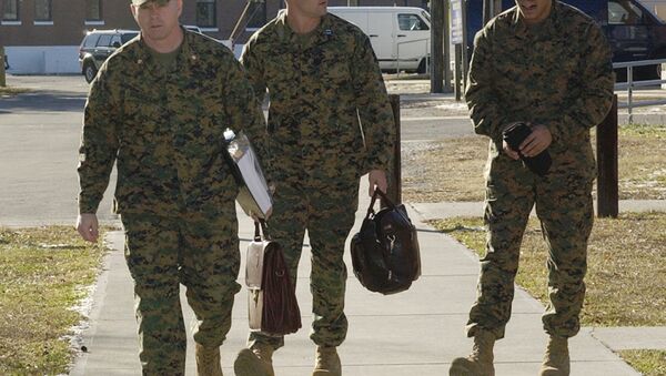 Cpl. Wassef Ali Hassoun, right, walks with defense attorneys Maj. Phillip E. Stackhouse, left, and Capt. Brandon Bolling for the first day of the Article 32 pre-trial investigation, Tuesday, Dec. 21, 2004, at Camp LeJeune, N.C. Hassoun is charged with desertion after he disappeared from his unit in Iraq and later claimed to be kidnapped. - Sputnik International