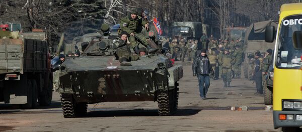 Independence supporters ride on an armored vehicle in the center of Debaltseve, Ukraine, Monday, Feb. 23, 2015 Independence supporters ride on an armored vehicle in the center of Debaltseve, Ukraine, Monday, Feb. 23, 2015 - Sputnik International