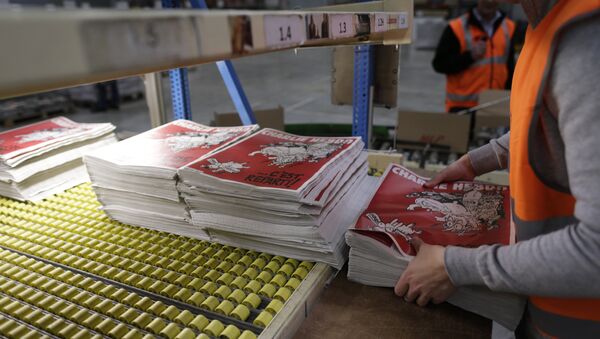 An employee checks the forthcoming edition of the weekly newspaper Charlie Hebdo, on February 24, 2015 in Villabe, south of Paris - Sputnik International