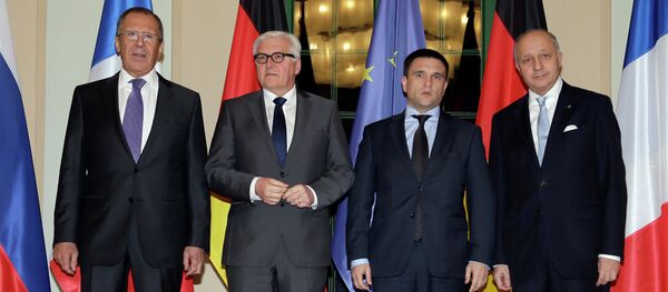 German Foreign Minister Frank-Walter Steinmeier, second left, welcomes his counterparts from France, Laurent Fabius, right, Russia, Sergey Lavrov, left, and Ukraine, Pavlo Klimkin, second right, for a meeting in Berlin German Foreign Minister Frank-Walter Steinmeier, second left, welcomes his counterparts from France, Laurent Fabius, right, Russia, Sergey Lavrov, left, and Ukraine, Pavlo Klimkin, second right, for a meeting in Berlin - Sputnik International