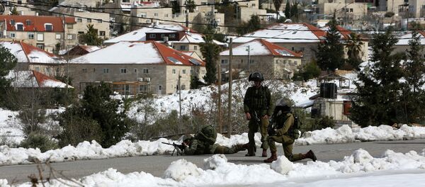 Israeli security forces stand guard during clashes with Palestinian youths from the Jalazoun refugee camp. File photo Israeli security forces stand guard during clashes with Palestinian youths from the Jalazoun refugee camp. File photo - Sputnik International