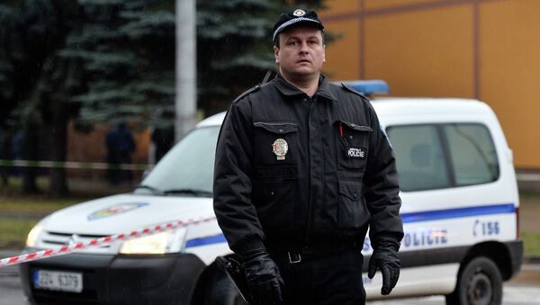 A police officer patrols near a restaurant where a gunman opened fire in Uhersky Brod, February 24, 2015 - Sputnik International