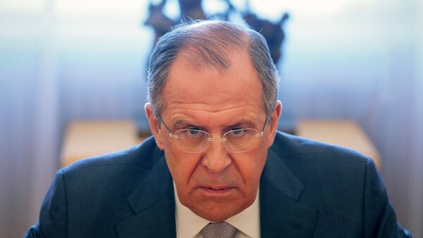 Russian Foreign Minister Sergei Lavrov looks on during a meeting with French Senate President Gerard Larcher in Moscow - Sputnik International
