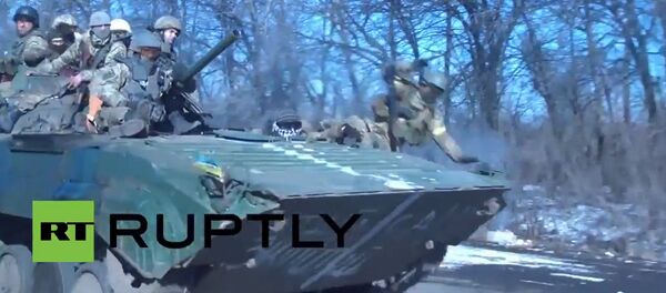 Ukrainian Soldier Falls Off Combat Vehicle During Troops Withdrawal Ukrainian Soldier Falls Off Combat Vehicle During Troops Withdrawal - Sputnik International