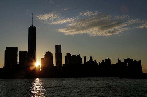 The sun rises next to One World Trade Center The sun rises next to One World Trade Center - Sputnik International