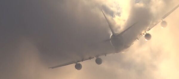 Airbus A380 Slashes Through Clouds Airbus A380 Slashes Through Clouds - Sputnik International