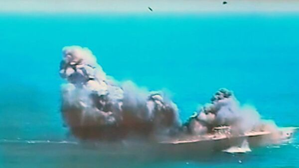 This image taken from Iranian state TV, shows damage to a mock U.S. aircraft carrier during large-scale naval and air defense drills by Iran's Revolutionary Guard, near the Strait of Hormuz, Iran - Sputnik International