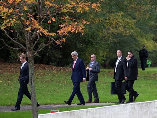 U.S. Secretary of State John Kerry, second left, walks in the grounds of the Intercontinental Hotel in Geneva, Switzerland, before a meeting with EU High Representative for Foreign Affairs, Catherine Ashton and Iranian Foreign Minister Mohammad Javad Zarif, Saturday Nov. 9, 2013. U.S. Secretary of State John Kerry, second left, walks in the grounds of the Intercontinental Hotel in Geneva, Switzerland, before a meeting with EU High Representative for Foreign Affairs, Catherine Ashton and Iranian Foreign Minister Mohammad Javad Zarif, Saturday Nov. 9, 2013. - Sputnik International