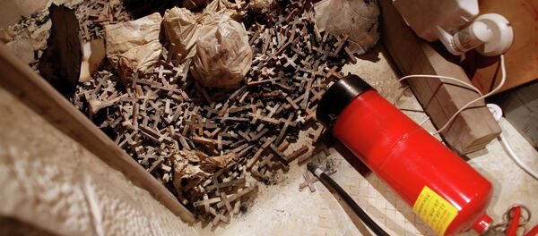 A picture taken on May 26, 2014 shows burnt wooden crosses and a fire extinguisher after arsonists set fire to a small section of the Church of the Dormition A picture taken on May 26, 2014 shows burnt wooden crosses and a fire extinguisher after arsonists set fire to a small section of the Church of the Dormition - Sputnik International
