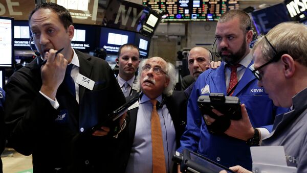 Traders gather at a post on the floor of the New York Stock Exchange,  Febuary 24, 2015 - Sputnik International