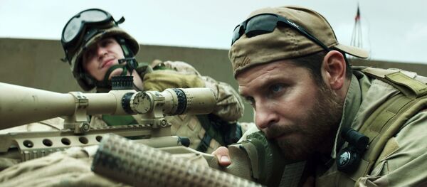 In this image released by Warner Bros. Pictures, Kyle Gallner, left, and Bradley Cooper appear in a scene from American Sniper. The film is based on the autobiography by Chris Kyle - Sputnik International