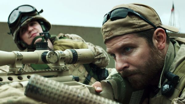 In this image released by Warner Bros. Pictures, Kyle Gallner, left, and Bradley Cooper appear in a scene from American Sniper. The film is based on the autobiography by Chris Kyle - Sputnik International