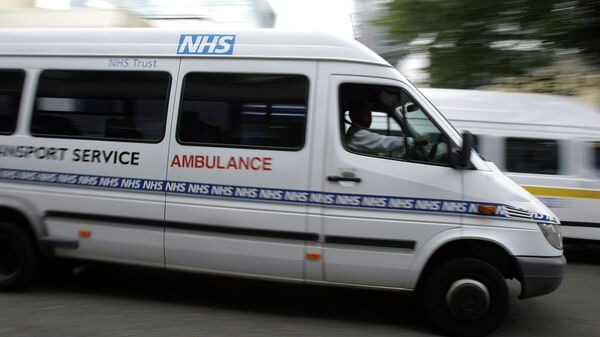 Ambulances belonging to the National Health Service, seen, outside one of London's major hospitals St Mary's, in Paddington, London - Sputnik International