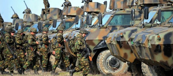 Soldiers of the Macedonian army prepare for military exercises during the Balkan Flash 2010 at Krivolak army training center, 120 km northeast of Skopje Soldiers of the Macedonian army prepare for military exercises during the Balkan Flash 2010 at Krivolak army training center, 120 km northeast of Skopje - Sputnik International