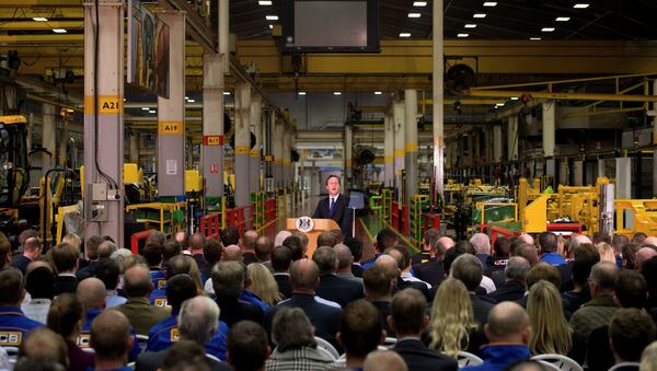 British Prime Minister David Cameron, background centre, delivers a speech on immigration to factory workers and members of the media, at JCB World Headquarters in Rocester, central England - Sputnik International